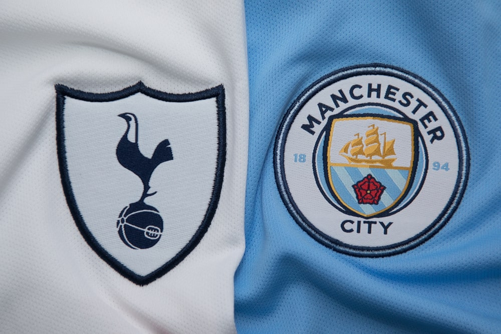 Manchester City, and Tottenham logos on jerseys